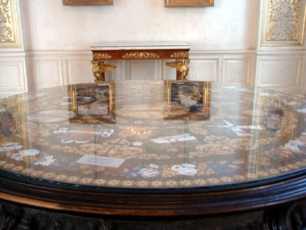 The table top is a mosaic of tiny semi-precious stones. 