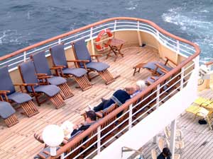 Adrian reading on deck